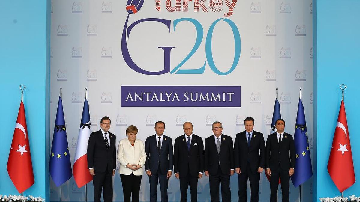 European Union leaders observe a minute of silence to honour the victims of the attacks in Paris, at the G-20 Summit in Antalya, Turkey, Monday, Nov. 16, 2015. From left to right, Spain's Prime Minister Mariano Rajoy, German Chancellor Angela Merkel, European Council President Donald Tusk, France's Foreign Minister Laurent Fabius, European Commission President Jean-Claude Juncker, British Prime Minister David Cameron, and Italian Prime Minister Matteo Renzi.
