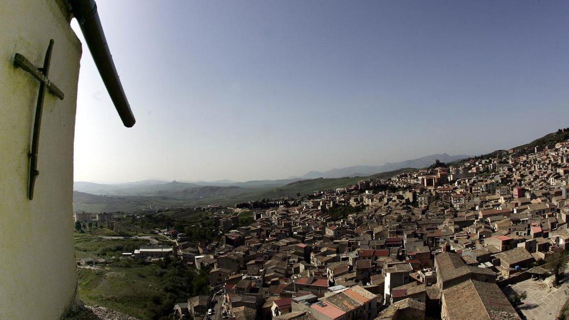 In this file photo taken on April 24, 2006, a crucifix towers over Corleone, Italy, the ancestral home and surname of the title characters in “The Godfather” films.