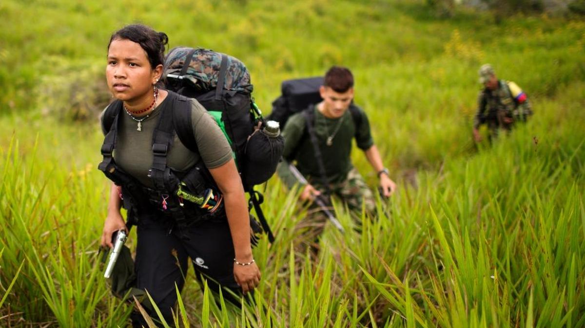 Women make up as much as 40 percent of leftist rebels. In this Jan. 6, 2016, photo, Gisell, 18, a rebel soldier of the 36th Front of the Revolutionary Armed Forces of Colombia, or FARC, treks to a new camp in Antioquia state, in the northwest Andes of Colombia.