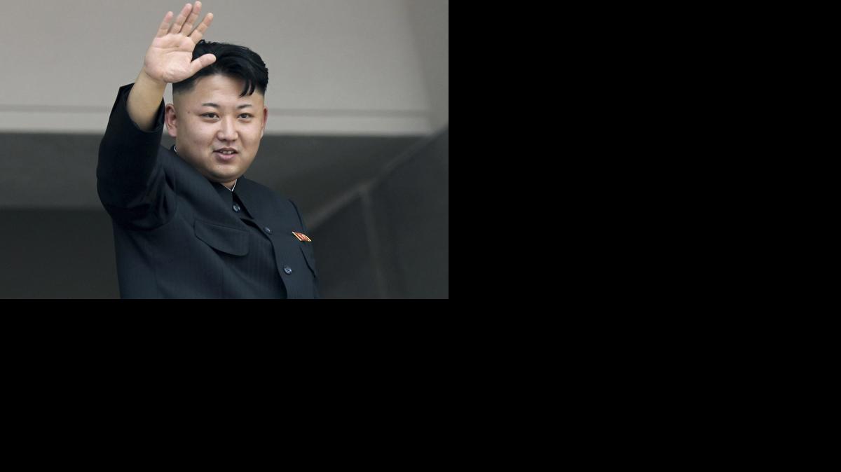
In this July 27, 2013 file photo, North Korea's leader Kim Jong Un waves to spectators and participants of a mass military parade celebrating the 60th anniversary of the Korean War armistice in Pyongyang, North Korea. President Barack Obama is "recklessly" spreading rumors of a Pyongyang-orchestrated cyberattack of Sony Pictures, North Korea says, as it warns of strikes against the White House, Pentagon and "the whole U.S. mainland, that cesspool of terrorism."
