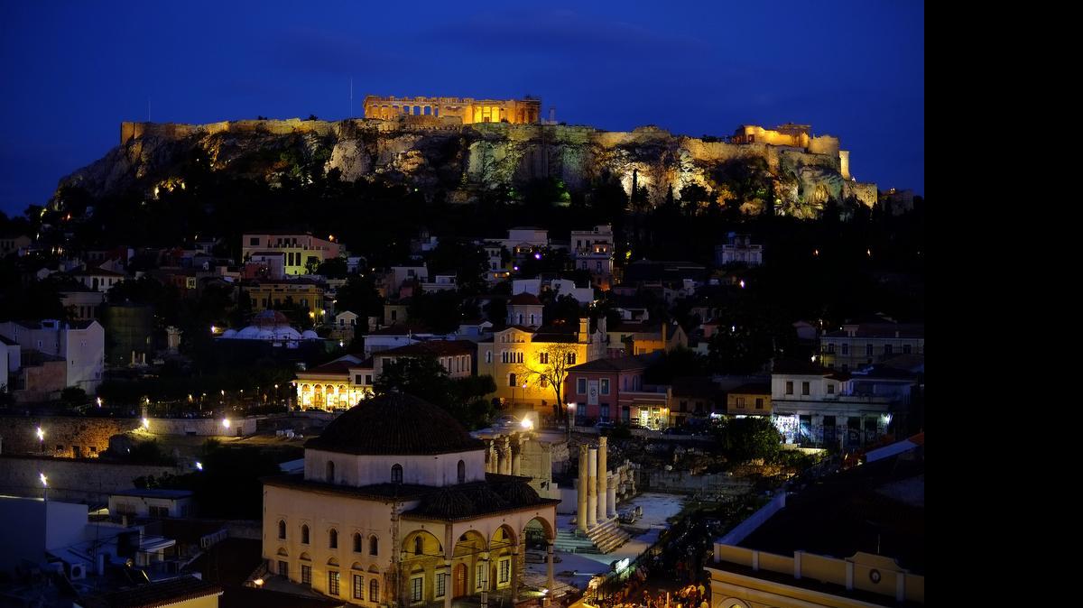 
The ancient Acropolis hill, with the ruins of the fifth-century BC Parthenon temple in seen after a sunset in central Athens on Wednesday. Greece's government pressed ahead with its plan to put austerity measures to voters after European creditors rebuffed its latest proposal for a new aid program. 
