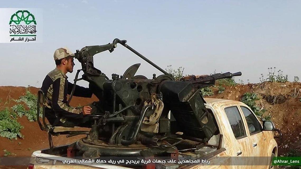 In this image posted on the Twitter page of Ahrar al-Sham on May 6, 2016, an Ahrar al Sham fighter guards the front lines of Breidige village in northwest Syria. Unlike the Islamic State group and al-Qaida's branch in Syria, the Nusra Front, Ahrar al-Sham is not on the U.S. list of terrorist organizations.