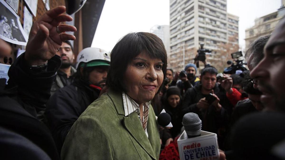 
Carmen Quintana attends a tribute for slain photographer Rodrigo Rojas, outside the Gabriela Mistral museum, in Santiago, Chile, Tuesday, July 28, 2015. During a street demonstration on July 2, 1986, soldiers doused Rojas and then 18-year-old Quintana with gasoline and set them ablaze. Rojas died four days later. Quintana survived and underwent lengthy treatment for severe burns at a Canadian hospital. Her scarred face later became a symbol of the atrocities committed by Pinochet's dictatorship.
