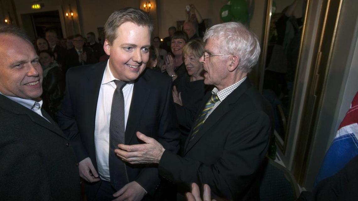Progressive Party chief Sigmundur David Gunnlaugsson, center, arrives to celebrate with his supporters following general elections on April 27, 2013, in Reykjavik, Iceland.