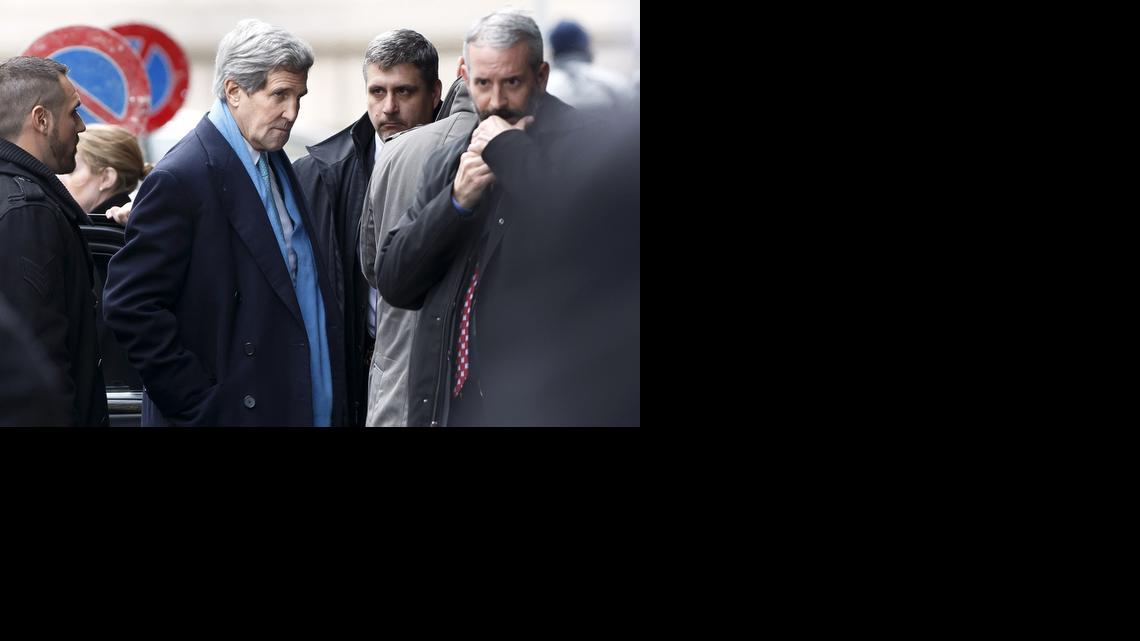 
U.S. Secretary of State John Kerry, center, arrives at the hotel prior to a bilateral meeting with Iranian Foreign Minister Mohammad Javad Zarif for a new round of Nuclear Talks, in Geneva, Switzerland, Sunday, Feb. 22, 2015.
