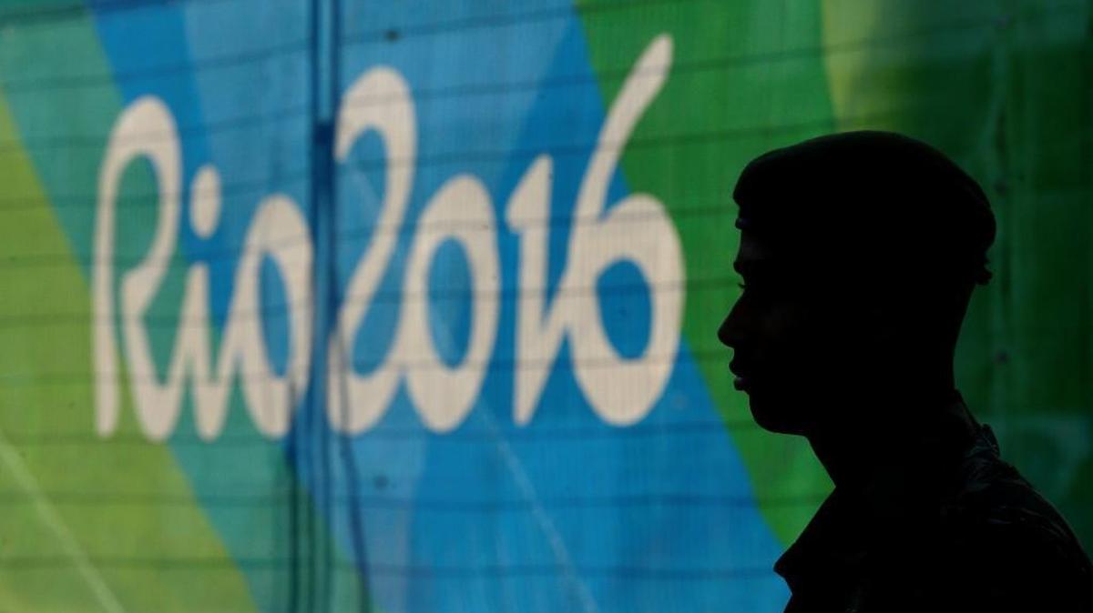 A guard stands in the Olympic athletes village in Rio de Janeiro, Brazil on Saturday, July 30, 2016. The games open on Friday.