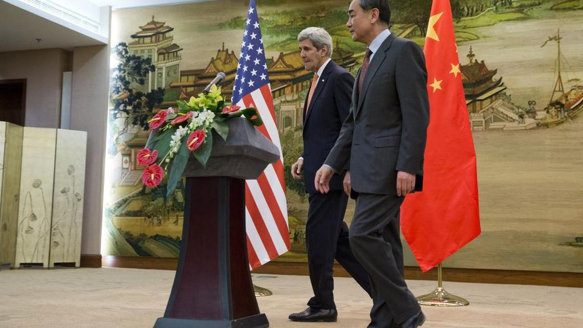 U.S. Secretary of State John Kerry, left, leaves a news conference with Chinese Foreign Minister Wang Yi at the Ministry of Foreign Affairs in Beijing, Wednesday, Jan. 27, 2016. Kerry is in China on the final leg in his latest round-the-world diplomatic mission.