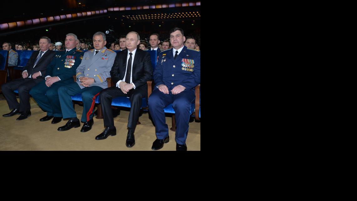 
Russian President Vladimir Putin, second right, and Defense Minister Sergei Shoigu, center, watch a concert marking the Defenders of the Fatherland Day, celebrated in Russia on Feb. 23, which honors the nation's military and is a nationwide holiday, in Moscow, Russia, Friday, Feb. 20, 2015. Putin says he will not allow anyone to get a military advantage over Russia and pledges that the country will never yield to foreign pressure. 
