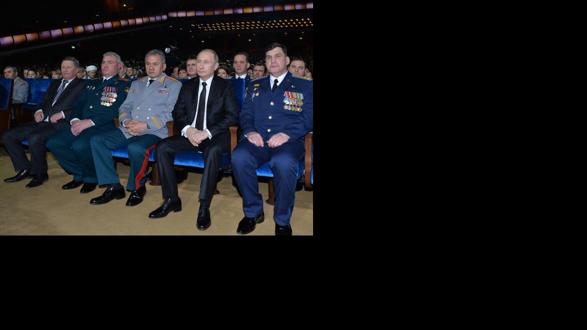 
Russian President Vladimir Putin, second right, and Defense Minister Sergei Shoigu, center, watch a concert marking the Defenders of the Fatherland Day, celebrated in Russia on Feb. 23, which honors the nation's military and is a nationwide holiday, in Moscow, Russia, Friday, Feb. 20, 2015. Putin says he will not allow anyone to get a military advantage over Russia and pledges that the country will never yield to foreign pressure. 
