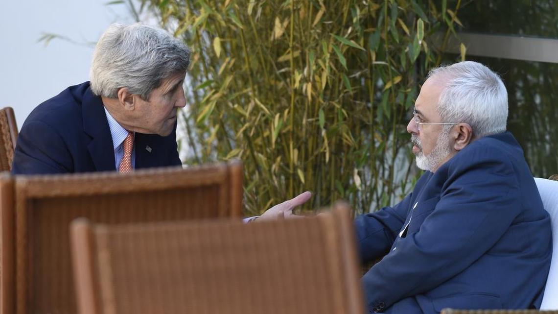 
U.S. Secretary of State John Kerry, left, talks with Iranian Foreign Minister Mohammad Javad Zarif, in Geneva, Switzerland, in May 2015. An unusual secret agreement with a U.N. agency will allow Iran to use its own experts to inspect a site allegedly used to develop nuclear arms, according to a document seen by The Associated Press.
