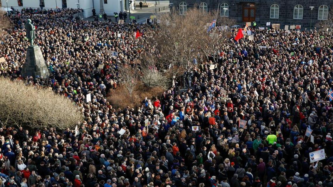People gather to demonstrate against Iceland's prime minister, in Reykjavik, Iceland, on Monday, April 4, 2016. Iceland's prime minister insisted Monday he would not resign after documents leaked in a media investigation allegedly link him to an offshore company that could represent a serious conflict of interest, according to information leaked from a Panamanian law firm at the center of an international tax evasion scheme.