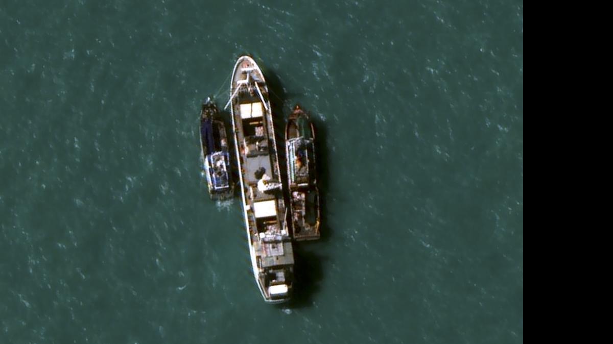 
In this July 14, 2015, image provided by DigitalGlobe, a high-resolution satellite photograph off the coast of Papua New Guinea shows two fishing trawlers loading slave-caught fish onto Silver Sea 2, a refrigerated cargo ship belonging to the Thai-owned Silver Sea Fishery Co. The company was named in an Associated Press investigation into slavery in Southeast Asia’s seafood industry that led to the rescue and repatriation of more than 800 men. Hundreds more remain missing after their trawlers fled an Indonesian crackdown on illegal fishing.
