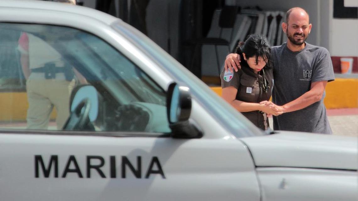 A Mexican navy sailor helps a Cuban migrant after being rescued off Cozumel, Mexico, March 19, 2016.