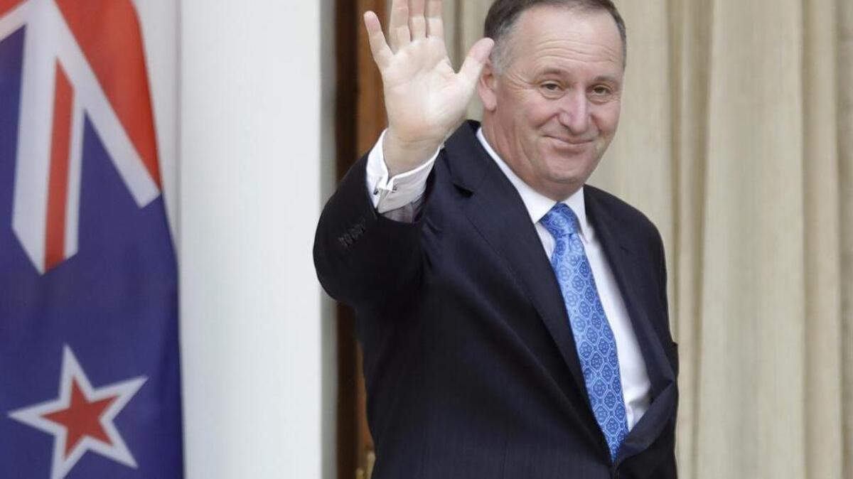 New Zealand Prime Minister John Key waves to media before his meeting with Indian counterpart Narendra Modi in New Delhi, India, Oct. 26, 2016. John Key stunned the nation on Monday, Dec. 5 when he announced he was resigning after eight years as leader.