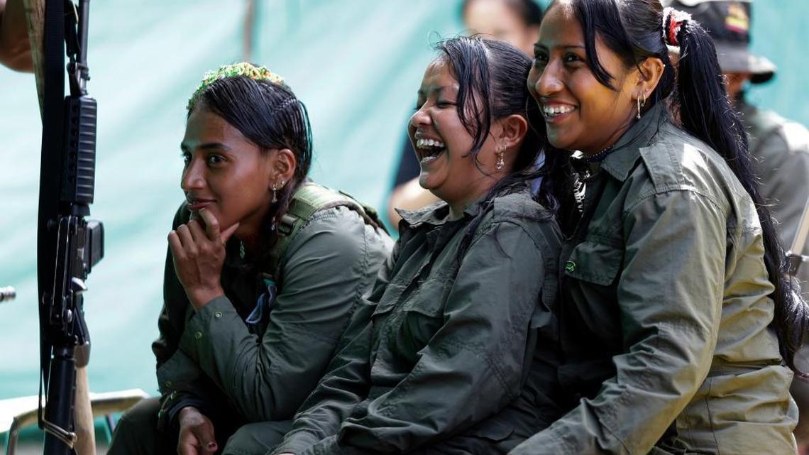 Revolutionary Armed Forces of Colombia rebels laugh during a break at their camp in the jungles of Putumayo, Colombia. The government of Colombia may not be able to depend on some U.S. aid to help rebels prepare for a life without arms.