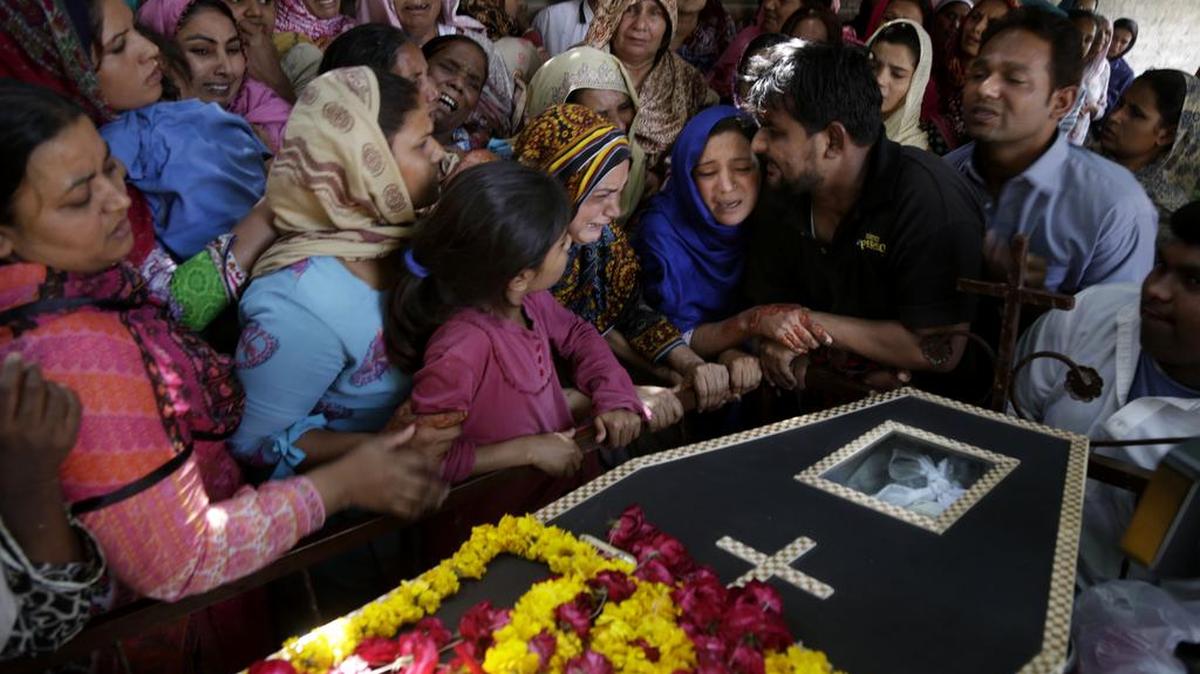 Pakistani Christian women mourn the death of Sharmoon who was killed in a bombing attack, in Lahore, Pakistan, Monday, March 28, 2016.