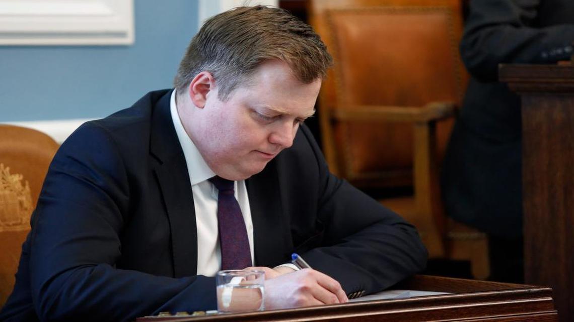 Iceland's Prime Minister Sigmundur David Gunnlaugsson resigned April 5, 2016, after documents leaked in a media investigation allegedly link him to an offshore company that would represent a serious conflict of interest, according to information leaked from a Panamanian law firm at the center of an international tax evasion scheme. In photo, Gunnlaugsson writes during a parliamentary session in Reykjavik on April 4, 2016.