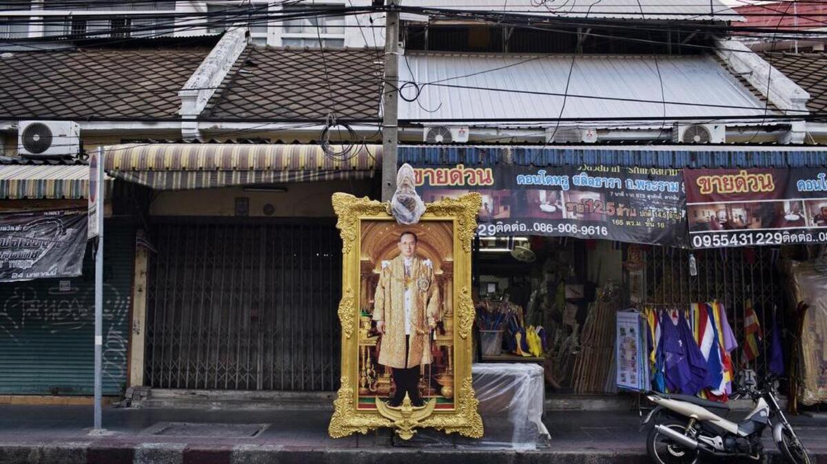 A framed image of King Bhumibol Adulyadej of Thailand, in Bangkok. Patnaree Chankij, 40, could face 15 years in prison for replying “ja,” similar to “yeah,” in response to a private online message allegedly disparaging the king