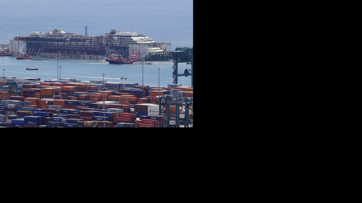 
In this July 27, 2014 file photo the wreck of the Costa Concordia cruise ship is towed by tugboats into Genoa's harbor, Italy. The captain of the shipwrecked Costa Concordia cruise ship was convicted Wednesday, Feb. 11, 2015 of multiple charges of manslaughter and sentenced to 16 years in jail, Italian court officials said. Francesco Schettino was convicted of manslaughter in the deaths of 32 passengers and crew in the Jan. 13, 2012 capsizing as well as of causing a shipwreck and abandoning ship while many of the 4,200 passengers and crew were still on the ship. The verdict and sentencing brought an end to a trial that has been running since July 2013. Prosecutors had insisted Schettino was a "reckless idiot" and asked the court to sentence him to 26 years and three months in prison. 
