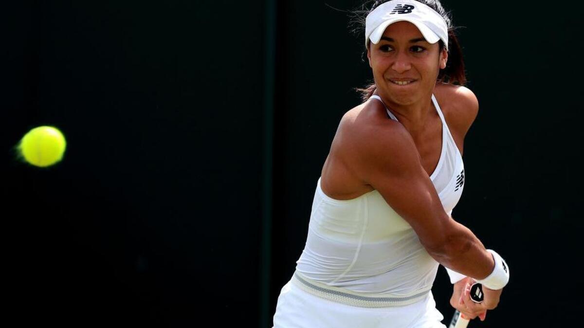 Britain's Heather Watson plays a return to Germany’s Annika Beck during their women's singles match at the Wimbledon Championships in London Thursday. Watson, who lost, said she sometimes goes on social media to read some of the nasty things people write about her as a means of punishing herself.