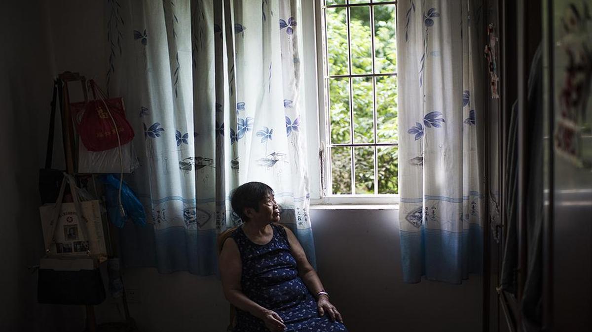 
Chen Guifang sits near the window in her apartment in Chongqing, China on Aug. 12, 2015. On May 4, 1939, 7-year-old Chen was huddled inside a crowded cave in Chongqing – China’s wartime capital in its southern interior – as Japan bombed the city for a second straight day. Shrapnel rocketed everywhere, wounding Chen and killing both of her parents. Nearly 12,000 died in the Japanese bombing of Chongqing during World War II.
