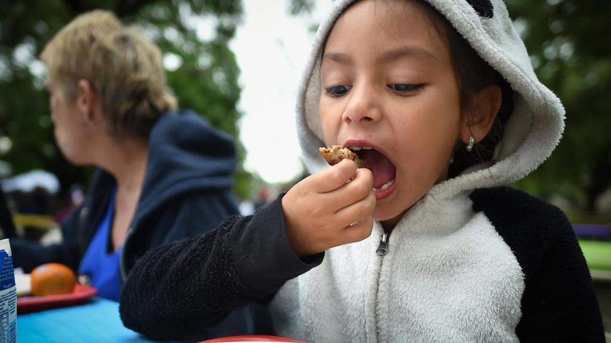 In her panda coat, Kaelynn Ramirez, 6, of Fresno, gets down to business with her plate of pancakes on Saturday April 9, 2016. Peru is making a play for the U.S. blueberry market