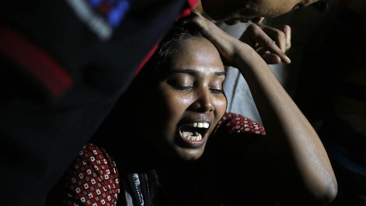 
Ashamoni, wife of blogger Niloy Chowdhury, cries at her house in Dhaka, Bangladesh, Aug. 7, 2015. Assailants believed to be Islamist militants entered an apartment building posing as potential tenants and killed the secular blogger in Bangladesh's capital. 
