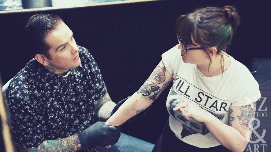 A woman, not the one detailed in the study, prepares for a tattoo.