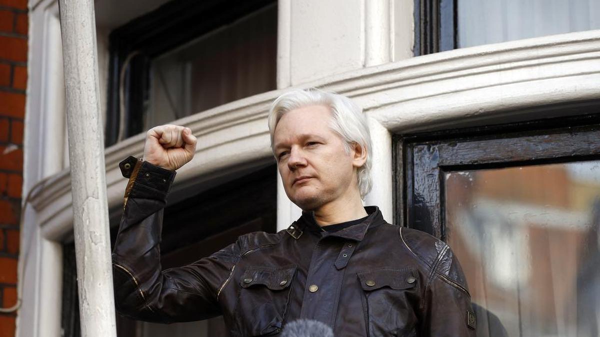 Julian Assange greets supporters outside the Ecuadorian embassy in London, Friday May 19, 2017. Assange took refuge in Ecuador's embassy in London in 2012 to escape extradition to Sweden to answer questions about sex-crime allegations from two women.