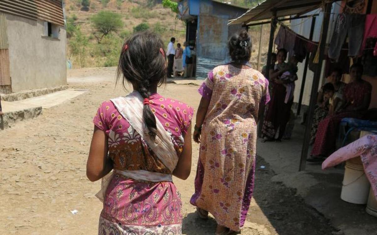 Seven men from an informal village council were arrested after they beat a victim for not speaking up when her father raped her. Such village councils in India often intervene in cases of sexual violence instead of the formal police and court system and exact their own punishments, making it difficult for victims to obtain justice. Here, the victim walks with her sister-in-law.