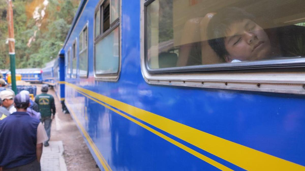 A passenger naps on a train in Aguascalientes, Peru, on July 10, 2015. China has offered to pony up $10 billion to study and later build a transcontinental railway from Brazil's Atlantic coast to Peru's Pacific coast to facilitate trade with Asia.