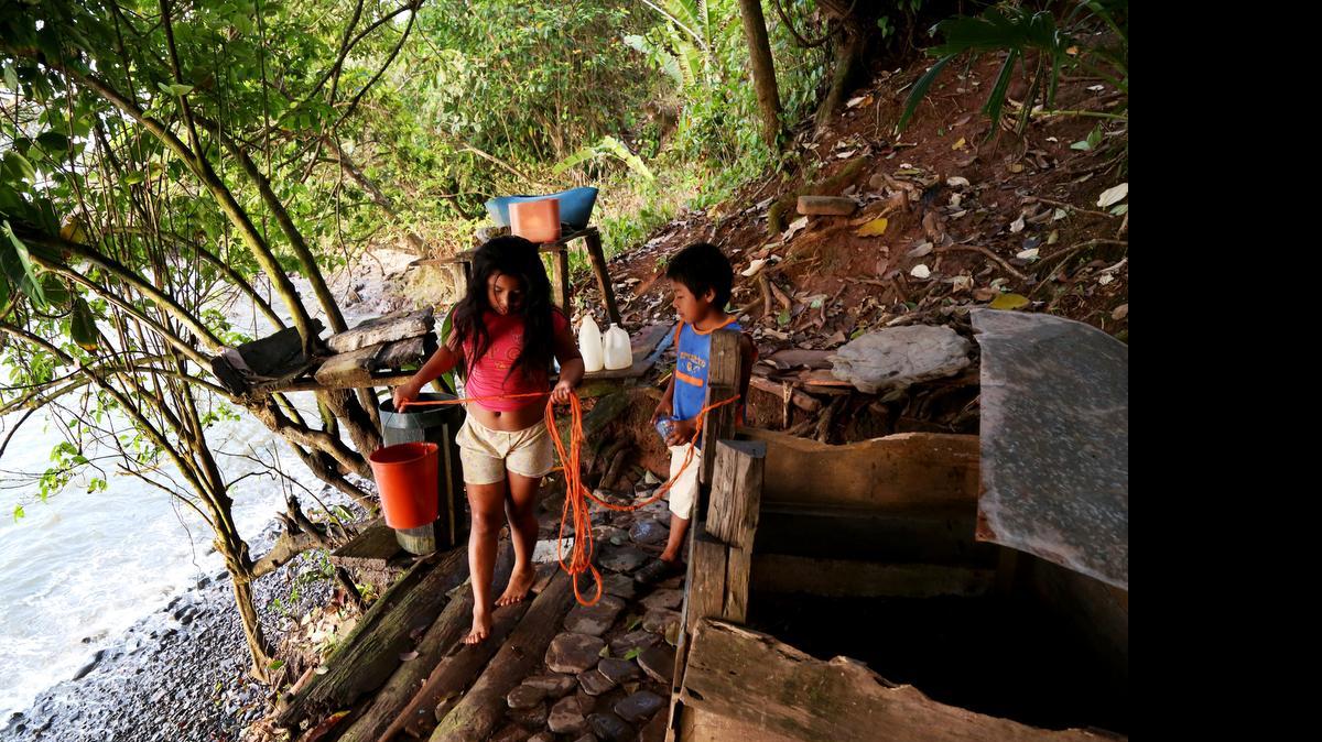 Children gather water for bathing in the morning in the Rama Indian village, Bangkukuk. If the Nicaragua canal is built, construction designs indicate a massive container port will be built right on the shore of Bangkukuk. Photo taken March 18, 2015.