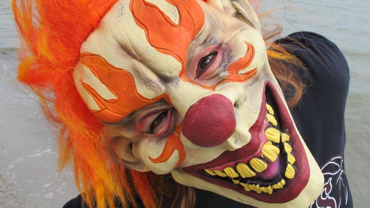 Photo shoot on Texas Beach, of someone wearing an eerie clown mask before Halloween. (Taken October 2013)