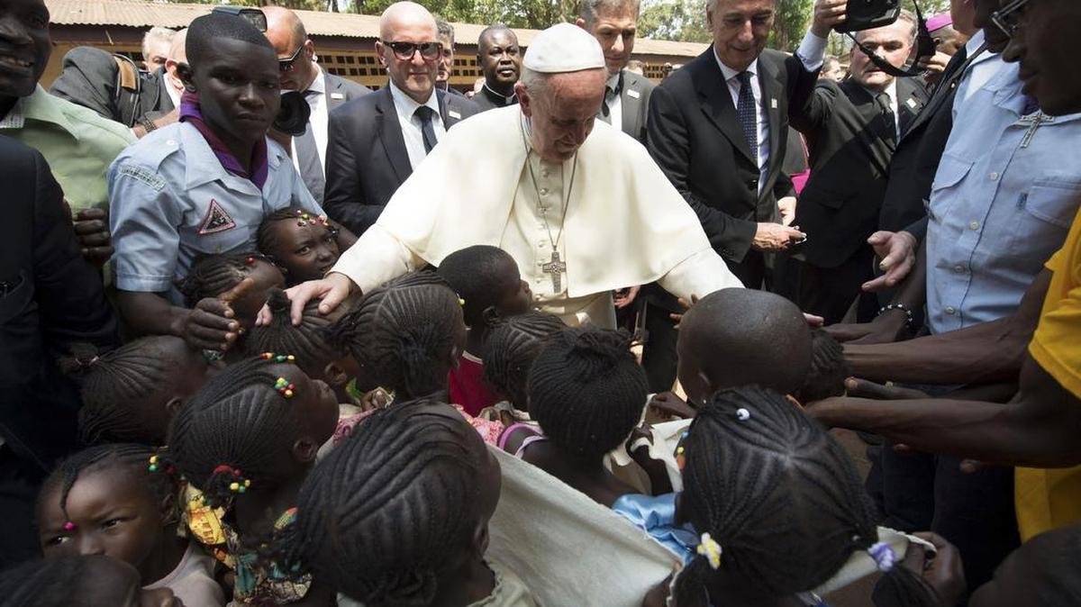 Pope Francis blesses children as he visits a refugee camp in Bangui, Central African Republic on Sunday.