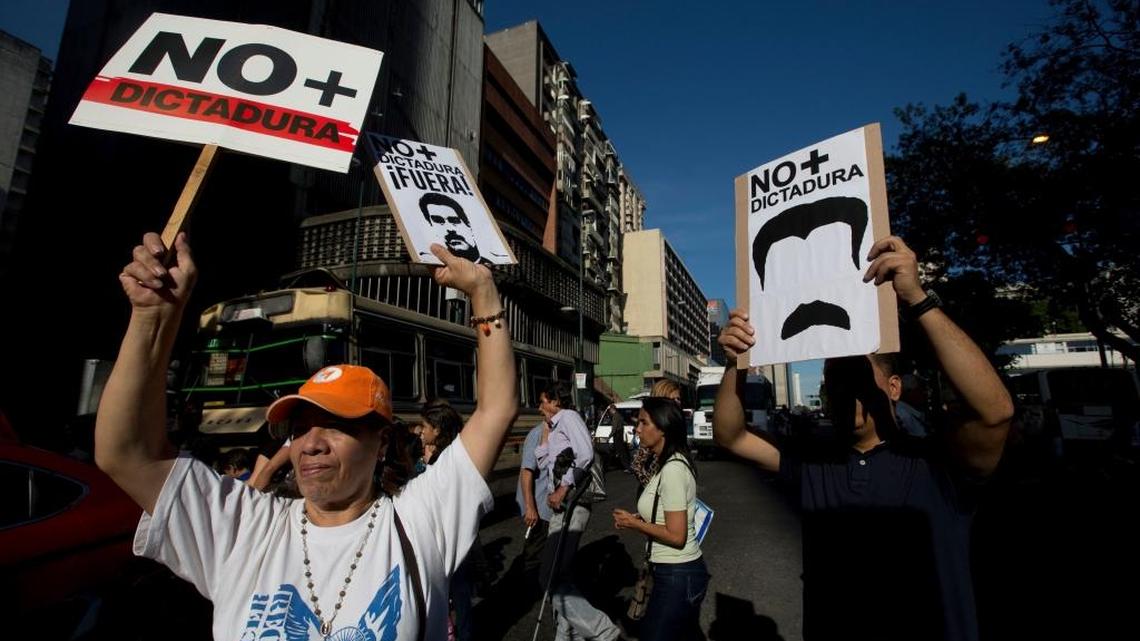 Opposition members take part in a protest against Venezuela's President Nicolas Maduro, in Caracas, Venezuela, Friday, March 31, 2017. Venezuelans have been thrust into a new round of political turbulence after the government-stacked Supreme Court gutted congress of its last vestiges of power, drawing widespread condemnation from foreign governments and sparking protests in the capital.