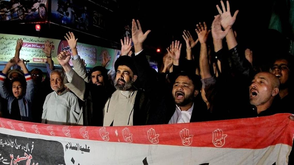 Pakistani Shiite Muslims chant slogans to condemn the bomb explosion in Kurram tribal region during a demonstration, in Karachi, Pakistan, Sunday, Dec. 13, 2015. A bomb explosion in a market on Sunday killed more than 20 minority Shiite Muslims and wounded dozens in Pakistan's Kurram tribal region near the Afghan border, officials said.
