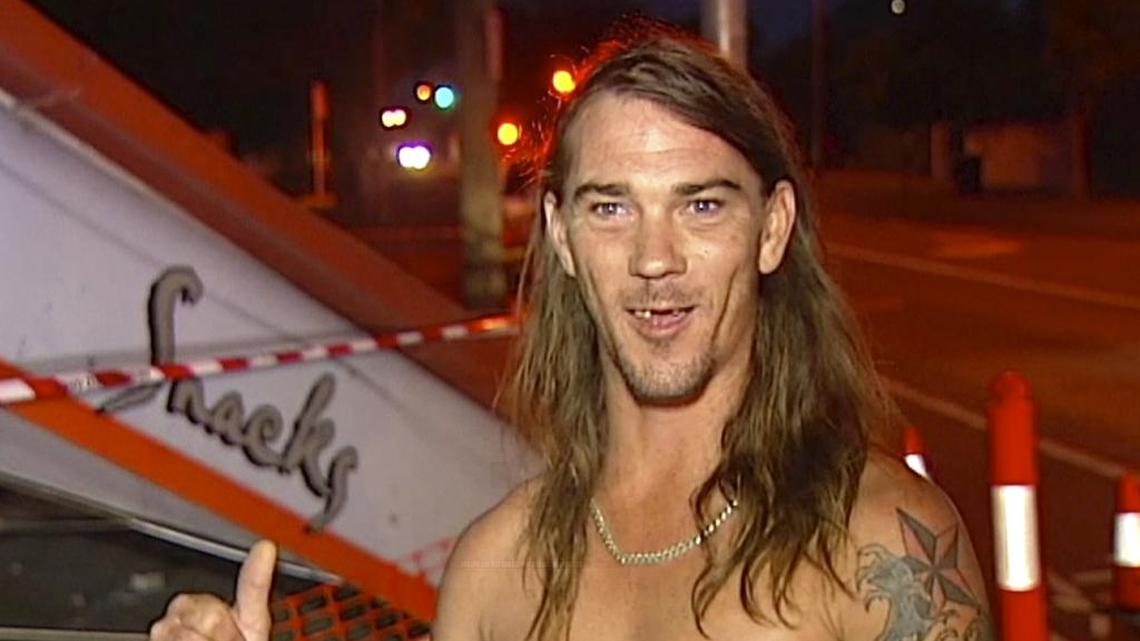 In this photo taken taken from video, Daniel McConnell describes the scene of a car crash during a television interview Thursday, Nov. 24, 2016, in Brisbane, Australia. McConnell, dressed only in his underpants, helped police arrest the unlicensed driver who alleged crashed a car into an Australian takeout restaurant then fled.