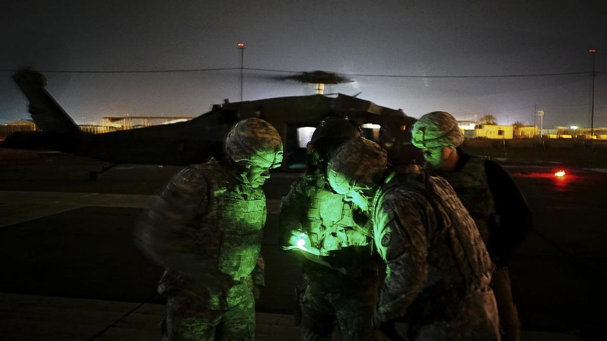 American military personnel disembark from a Black Hawk helicopter at Camp Taji in Iraq, Dec. 27, 2014. As American intelligence agencies grapple with the expansion of the Islamic State beyond its headquarters in Syria, the Pentagon has proposed a new plan to the White House to build up a string of military bases in Africa, Southwest Asia and the Middle East.