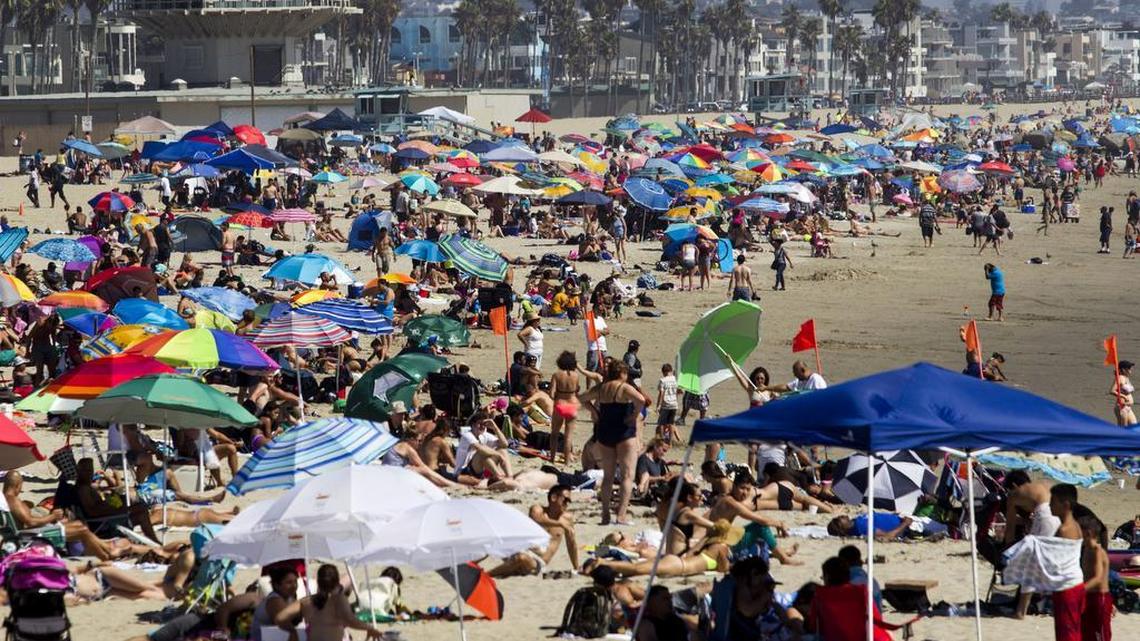 Beachgoers crowd at Venice Beach, Calif., Sunday, Aug. 16, 2015, during a heatwave.