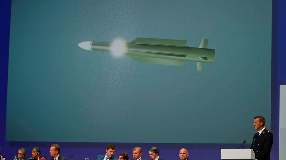 Wilbert Paulissen of the Joint Investigation Team probing the shooting-down of Malaysia Airlines Flight 17 displays a photo of a BUK missile that the group thinks downed the plane, killing 298 crew members and passengers. Leaked emails being published in German news media underscore the extent to which Russian advisers direct the media strategy of separatists in Ukraine’s east.