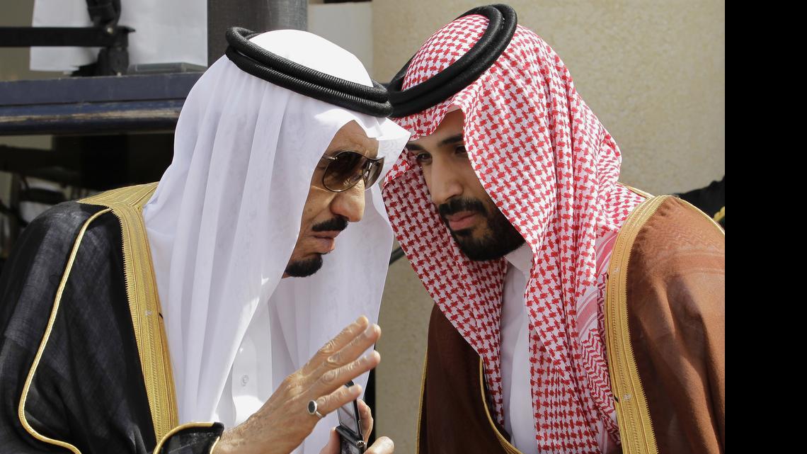 
Saudi King Salman, left, speaks with his son Prince Mohammed bin Salman as they wait for Gulf Arab leaders ahead of the opening of a Gulf Cooperation Council summit, in Riyadh, Saudi Arabia, May 14, 2012. On Wednesday, April 29, 2015, Prince Mohammed was appointed deputy crown prince, placing him second in line for the crown. 
