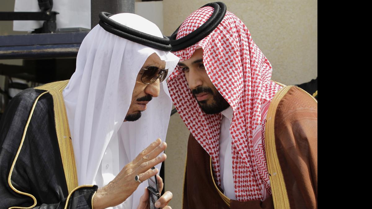 
Saudi King Salman, left, speaks with his son Prince Mohammed bin Salman as they wait for Gulf Arab leaders ahead of the opening of a Gulf Cooperation Council summit, in Riyadh, Saudi Arabia, May 14, 2012. On Wednesday, April 29, 2015, Prince Mohammed was appointed deputy crown prince, placing him second in line for the crown. 
