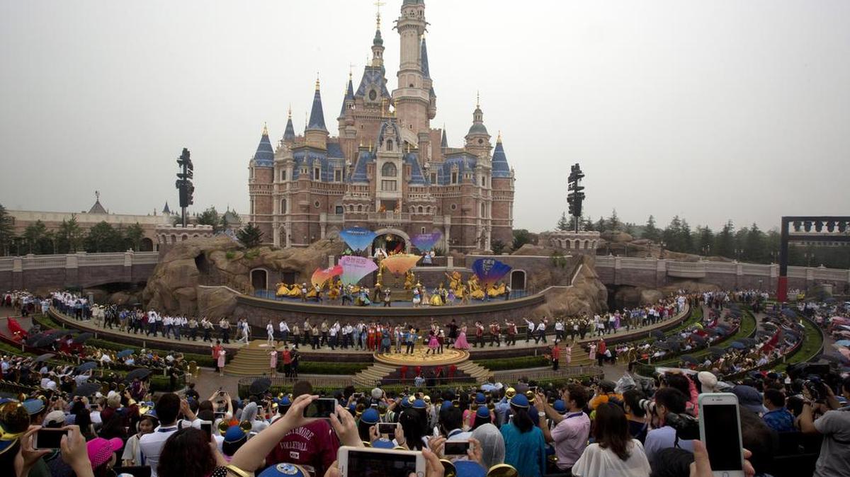 Performers take to the stage during the opening ceremony for the Disney Resort in Shanghai, China, on Thursday. Walt Disney Co. opened its first theme park in mainland China on Thursday at a ceremony that mixed speeches by Communist Party officials, a Chinese children's choir and actors dressed as Sleeping Beauty and other Disney characters.