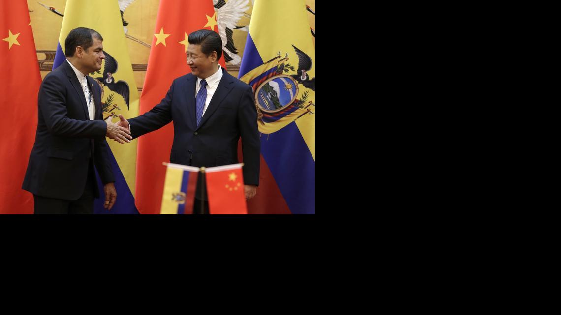 
Chinese President Xi Jinping, right, shakes hand with Ecuador's President Rafael Correa after they witnessed a signing ceremony at the Great Hall of the People in Beijing, China Wednesday, Jan. 7, 2015. 
