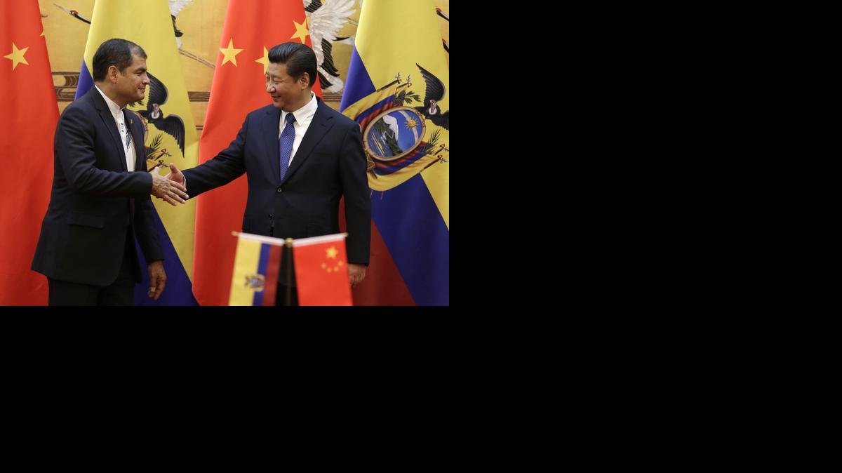 
Chinese President Xi Jinping, right, shakes hand with Ecuador's President Rafael Correa after they witnessed a signing ceremony at the Great Hall of the People in Beijing, China Wednesday, Jan. 7, 2015. 
