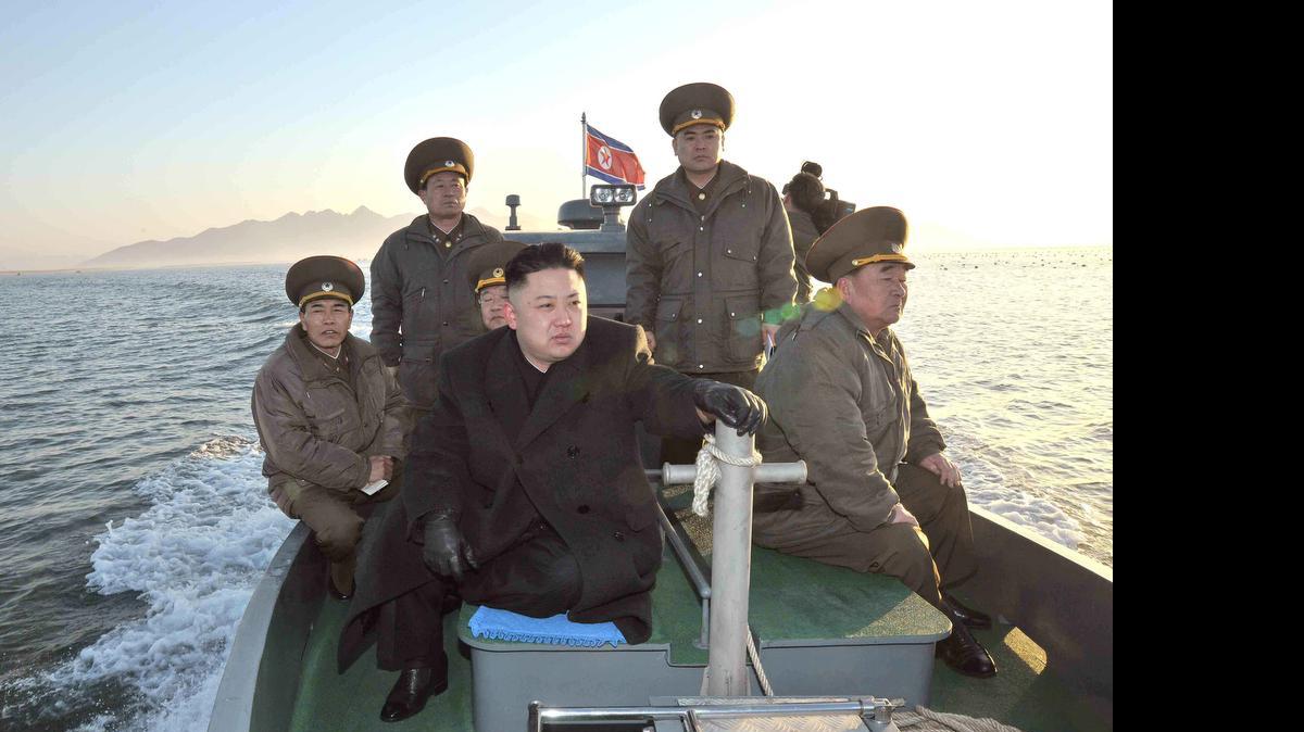 
A photo released by KCNA news agency on March 12, 2013, shows North Korea leader Kim Jong Un visiting the Wolnae-do Defence Detachment on the western front line. 
