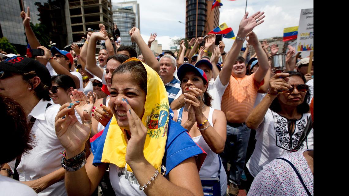 
Demonstrators cheer Lilian Tintori, the wife of jailed opposition leader Leopoldo López, during an anti-government protest in Caracas, Venezuela, Saturday. 
