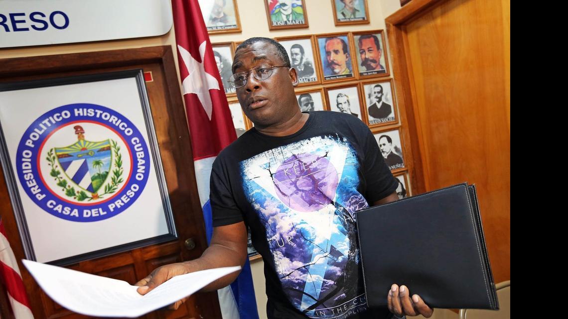 
Jorge Luis Garcia Perez “Antune,” a former political prisoner in Cuba, hands out a list of Cuban political prisoners after responding to the comments made by Cuban Cardinal Jaime Ortega in Spain that there are no political prisoners in Cuba, on June 16. Antunez says he and other dissidents will join the Ladies in White in their Sunday protests as a show of solidarity.
