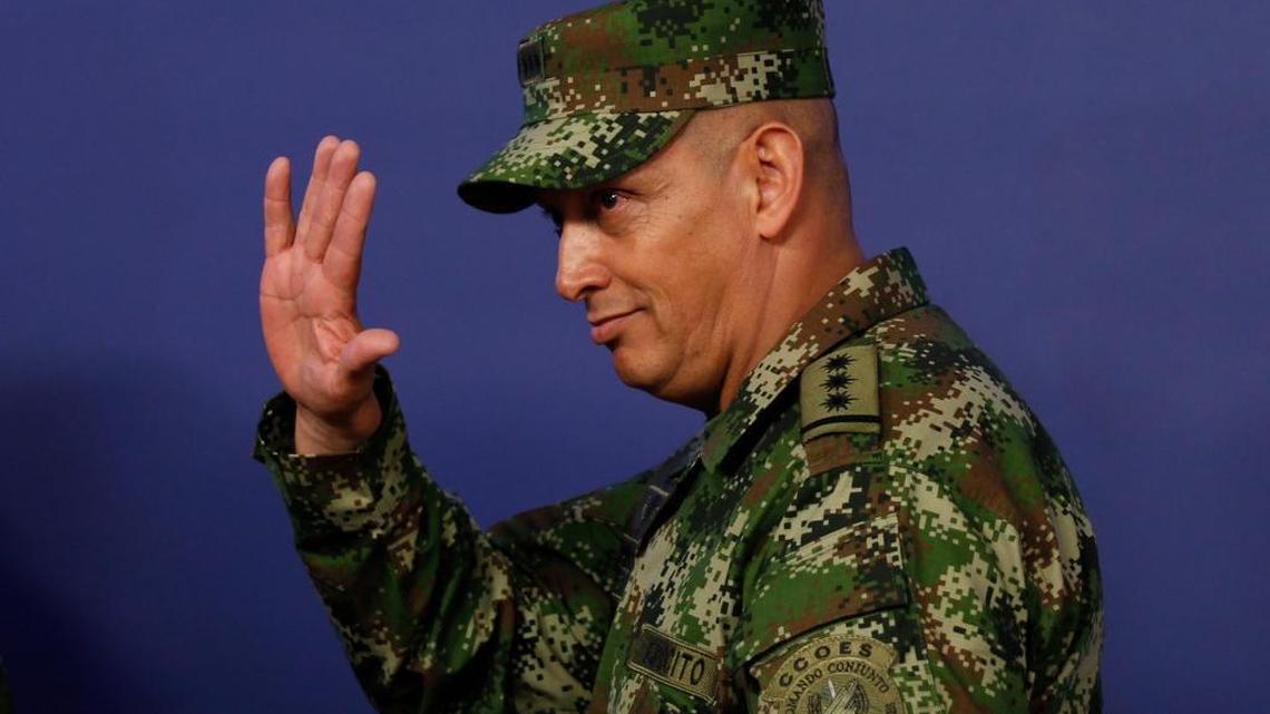 Gen. Jaime Lasprilla Villamizar, a Colombian army chief relieved of duties following a scathing report on the summary killing of almost 3,000 peasants, quietly resurfaced in his nation’s embassy in the U.S., to the ire of rights groups. In photo, Lasprilla waves after being appointed army commander in Bogota, Colombia, Feb. 18, 2014.