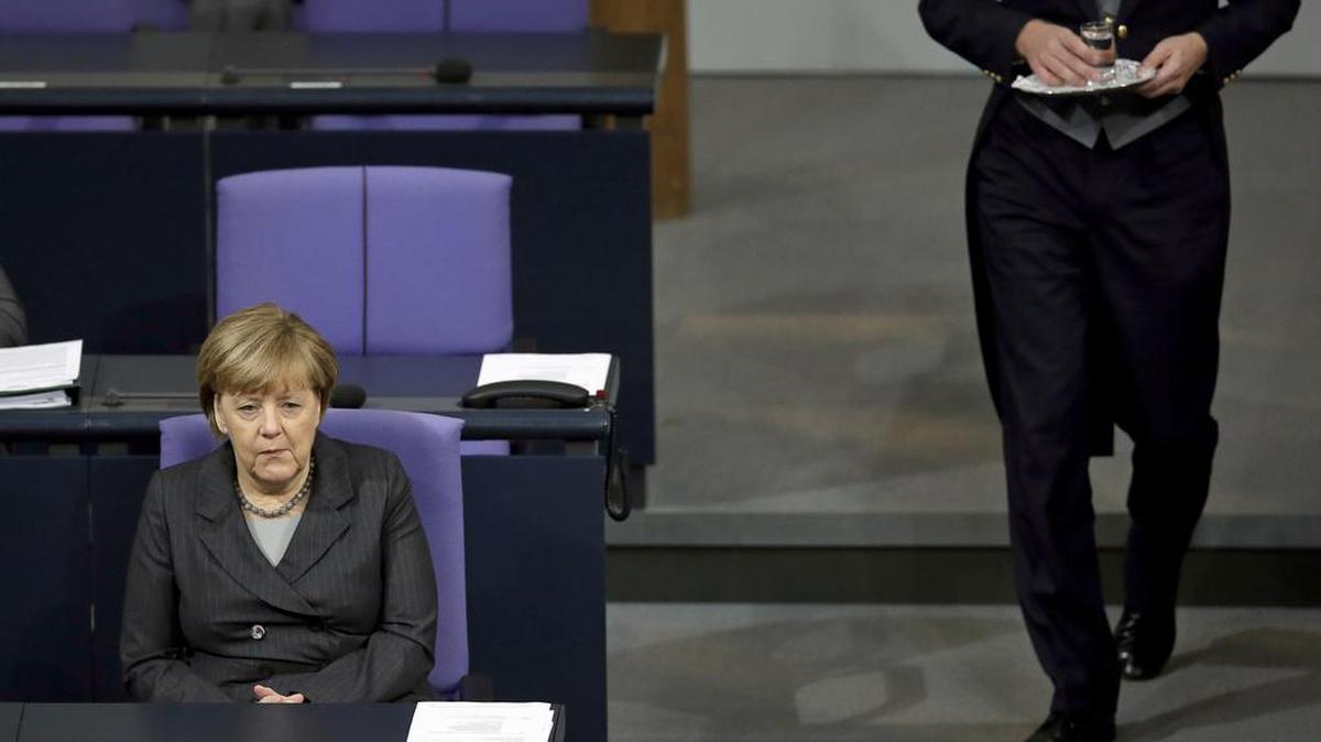 German Chancellor Angela Merkel attends a meeting of the German Federal Parliament, Bundestag, at the Reichstag building in Berlin, Germany, Friday, Dec. 4, 2015.